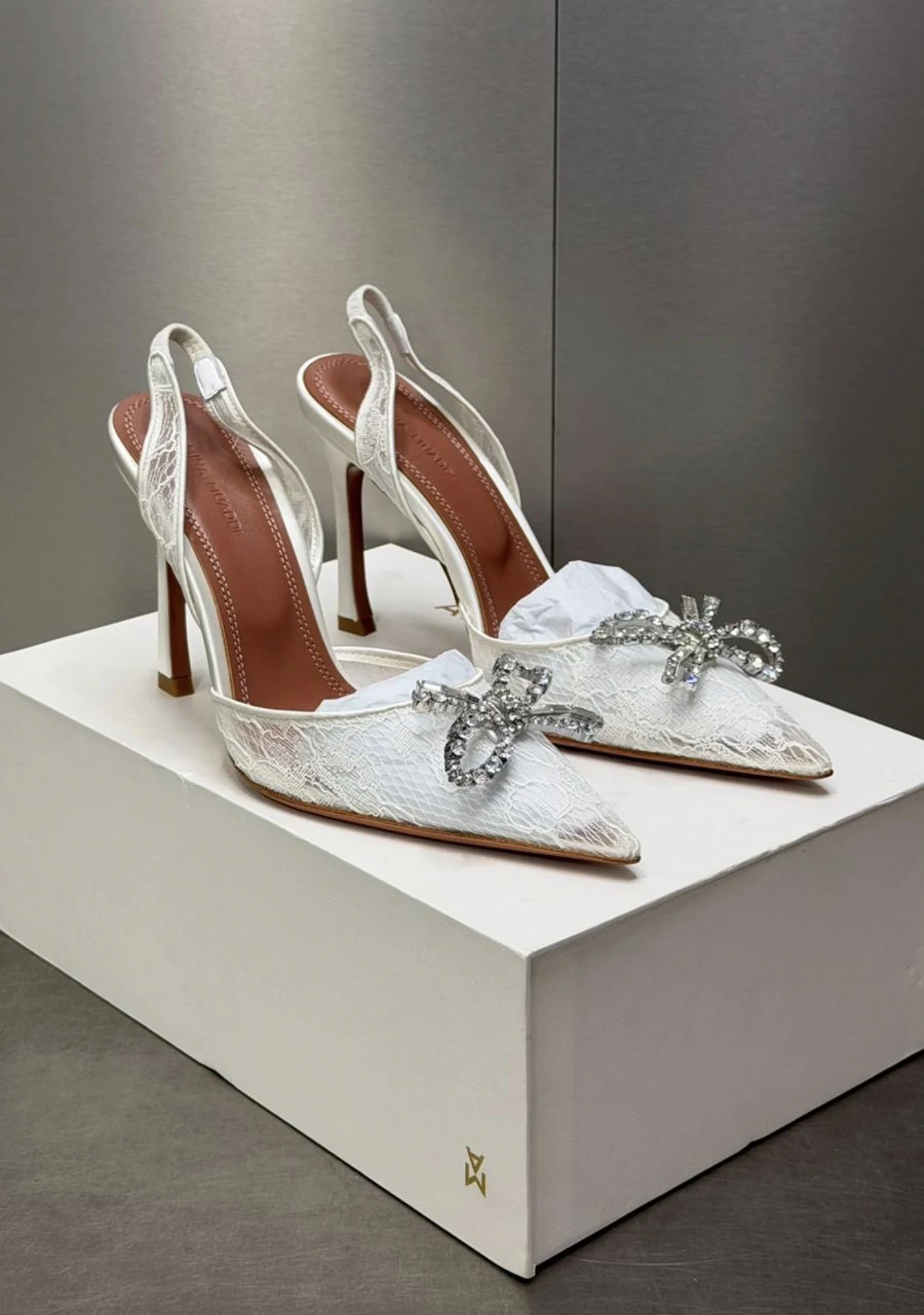 Amina muaddi slinback white